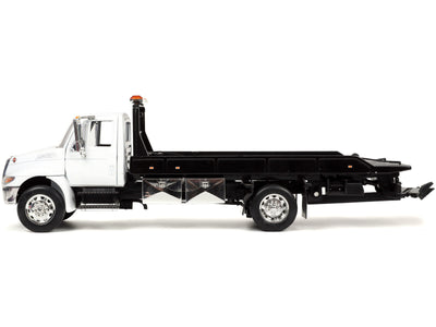1/24 CAMIÓN DE REMOLQUE INTERNACIONAL DURASTAR 4400 PLATAFORMA - BLANCO